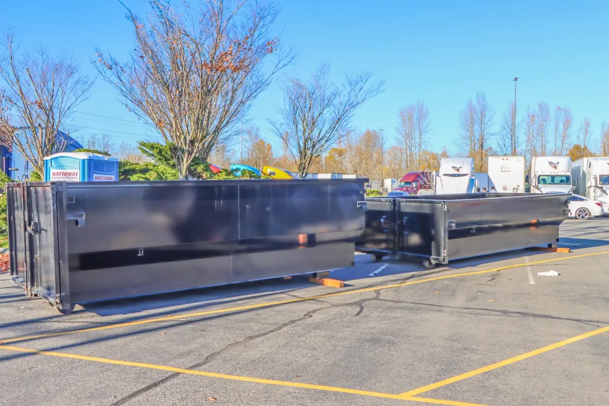 Professional dumpster rental service with roll-off container on residential driveway in Hawaiian Gardens